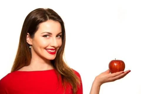 Positive Female Biting a Big Red Apple Fruit Smiling on White Holding Stock Photos