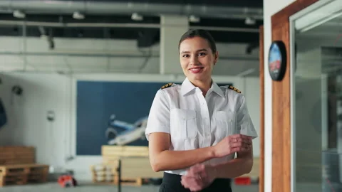 Positive female pilot, instructor standing in classsroom. Stock Footage 234390480