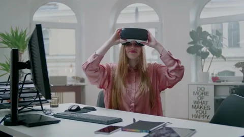 Positive Female Virtual Reality Programer Take Of HeadSet. Working at Home. Stockbeeldmateriaal 131552630