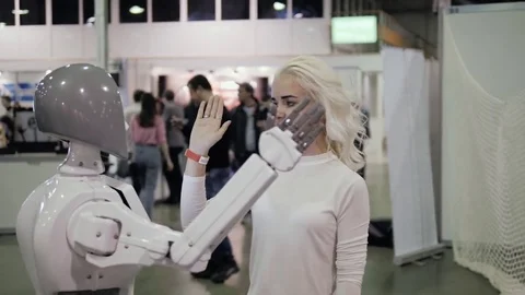 Positive girl and robot giving high Stock Video Pond5