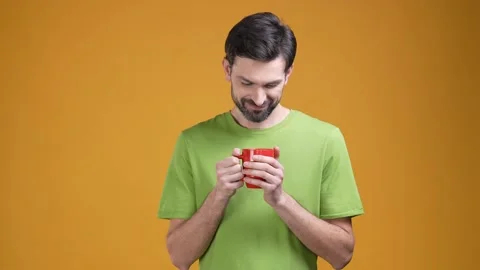 Positive guy like caffeine aroma isolated on shine color background Stock Footage 204989788