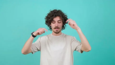 Positive guy pointing down, saying to subscribe, gesturing ok and like. Stock Footage 151352787