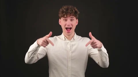 Positive guy pointing down, saying to subscribe, gesturing ok and like. Stock Footage 153616284