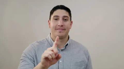 Positive handsome middle-aged Hispanic man shaking index finger, saying no Stock Footage 250130708