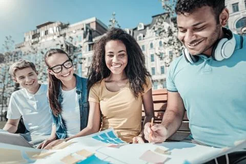 Positive happy students preparing for classes Stock Photos