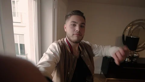 Positive hipster guy shooting himself Video stock 101026706
