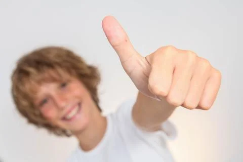 Positive kid with thumb up Stock Photos