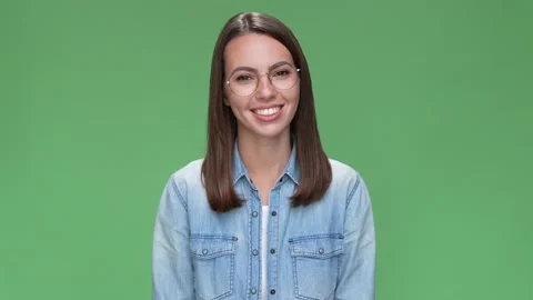 Positive lady representative toothy smiling isolated green color background Stock Footage 166043939