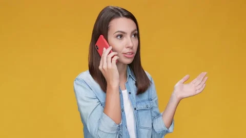 Positive lady say smart device tell news isolated mustard color background Stock Footage 166450767