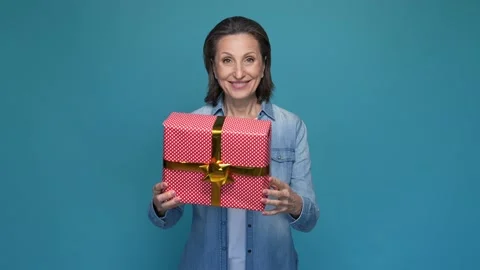 Positive lady shake package hug isolated blue color background Stock Footage 167319725