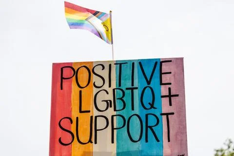 Positive LGBTQ support sign with progress pride flag Stock Photos
