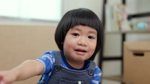 Positive little boy playing on sofa in living room with happy. Stock Footage 169915388