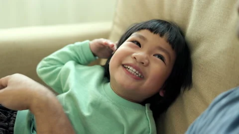 Positive little boy playing on sofa in living room with happy. Stock Footage 169915571