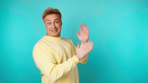 Positive man dancing having fun rhythm to music, enjoying life, entertainment. C Stockbeeldmateriaal 244913179