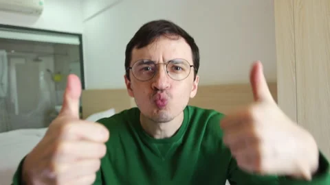 Positive man with thumbs up approving and agreeing Video stock 337367230