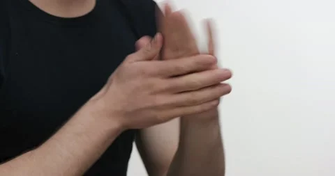 Positive Man using Antibacterial Spray for Disinfection hands. Young Guy Student Stock Footage 151945559