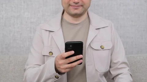 Positive man using phone Video stock 270304096