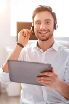 Positive man using tablet Stock Photos