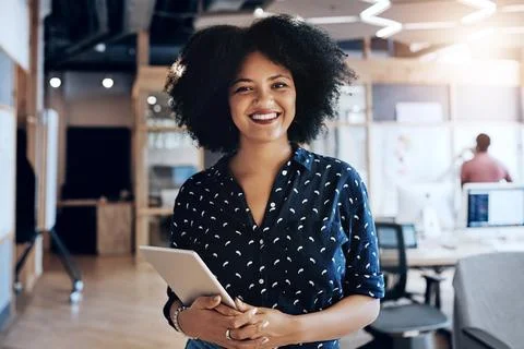 A positive mentality affects the whole work place. Portrait of an attractive Stock Photos