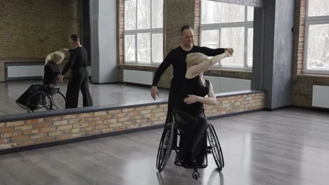 Positive middle aged couple dancing in ballroom Stock Footage 157920033