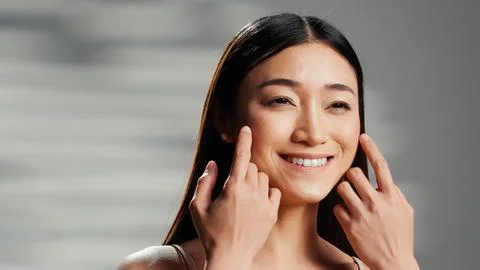 Positive model with luminous skin creating beauty ad 스톡 사진
