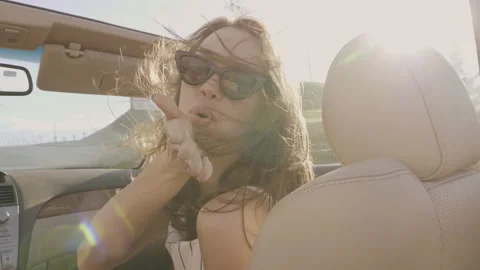Positive model riding and having fun at sunglasses Stock Footage 146108789