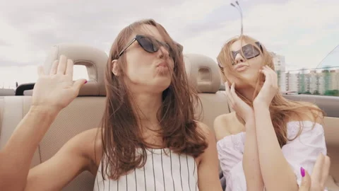 Positive models riding and having fun in sunglasses Stock Footage 146108137