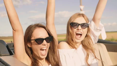 Positive models riding and having fun and raising hands Stock Footage 146108363