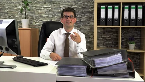 Positive office worker talking to a client Stock Footage 115877201