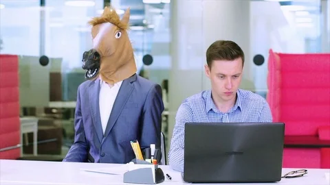 Positive office workers unsuccessfully joking with a tired colleague Stock Footage 73522103