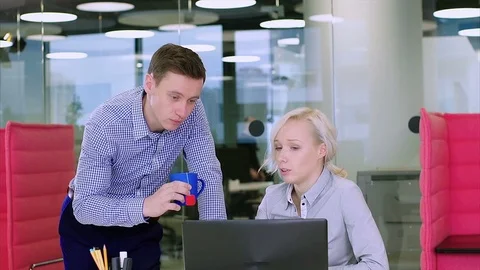 Positive office workers unsuccessfully joking with a female coworker Stock Footage 73526280