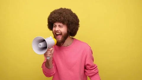 Positive optimistic man screaming in megaphone, announcing important Stock Footage 170718452