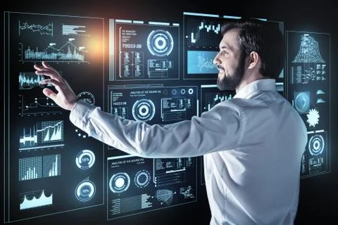 Positive programmer smiling and feeling satisfied with his work Foto stock