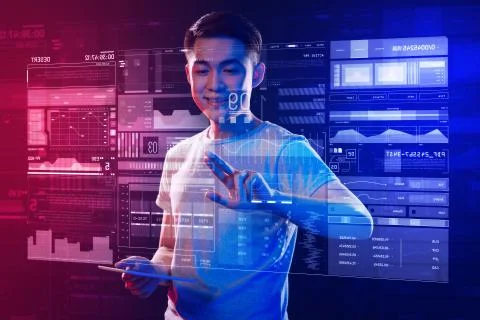 Positive programmer touching the screen with two fingers and smiling Stock Photos