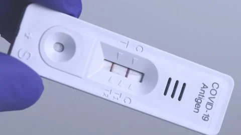 Positive rapid test for covid-19 virus Stock Footage 169010637
