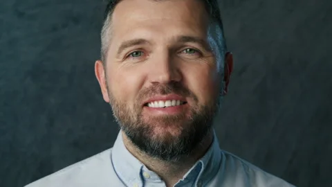 Positive smiling bearded man looking at camera, laughing with white teeth Stock Footage 267058279