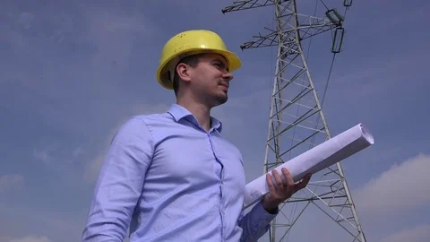 Positive smiling to camera happy engineer foreman electricity industry pillar 4K Stock Footage