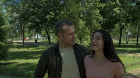 Positive smiling couple having a walk outdoors Stock Footage