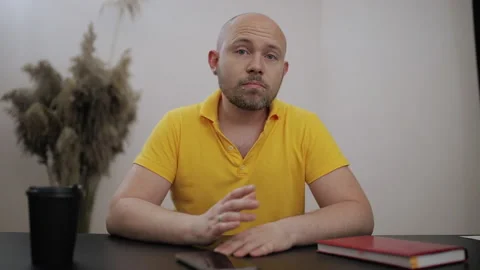 Positive smiling man chatting virtual Video conference is interrupted by call Stock Footage 199516654