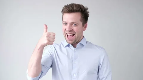Positive smiling man with thumb up Stock Footage 119655450