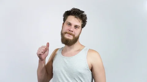 Positive Smiling Man With Thumb Up.The guy puts like.Different options. Stock Footage 122503972