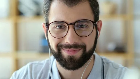 Positive student taking off glasses while smiling into camera Stock Footage 78736306