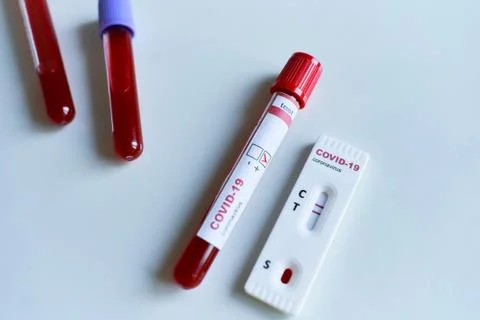 Positive test result by using rapid test device for COVID-19 virus and test t Stock Photos