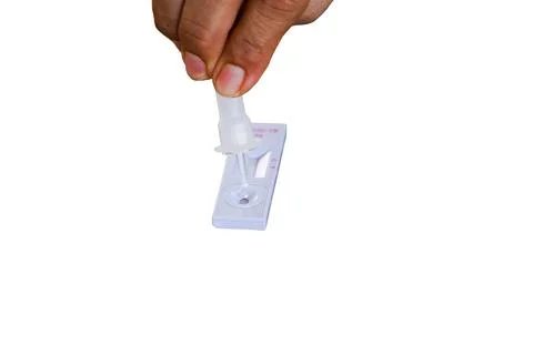 Positive test result by using rapid test for COVID-19 white background Stock Photos