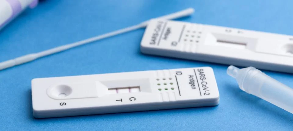 Positive test result by using rapid test device for COVID-19. Stock Photos
