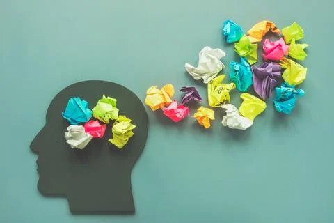 Positive thinking concept. Head shape and colorful paper balls. Stock Photos