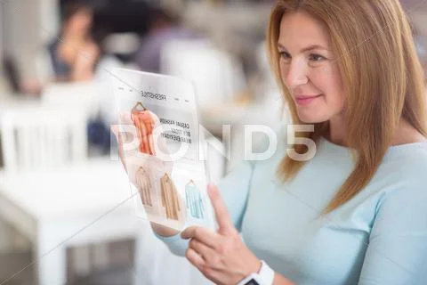 Positive woman using modern tablet Stock Photos