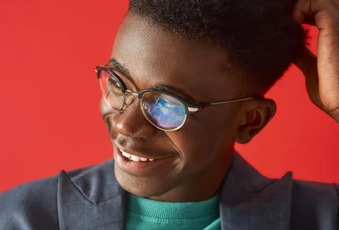 Positive young afro guy is looking with smile Stock Photos