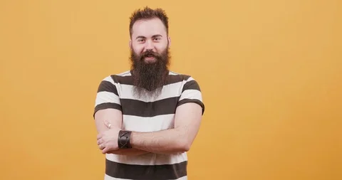 Positive young bearded man being joyful and laughing loud Stock Footage 104080686