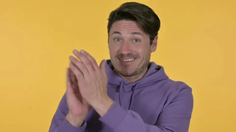 Positive Young Man Clapping, Yellow Background 스톡 동영상 141671065